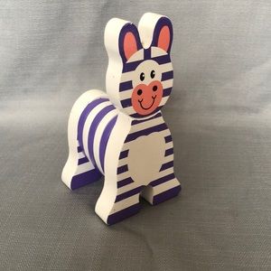 Melissa and Doug wood, purple and white striped zebra.